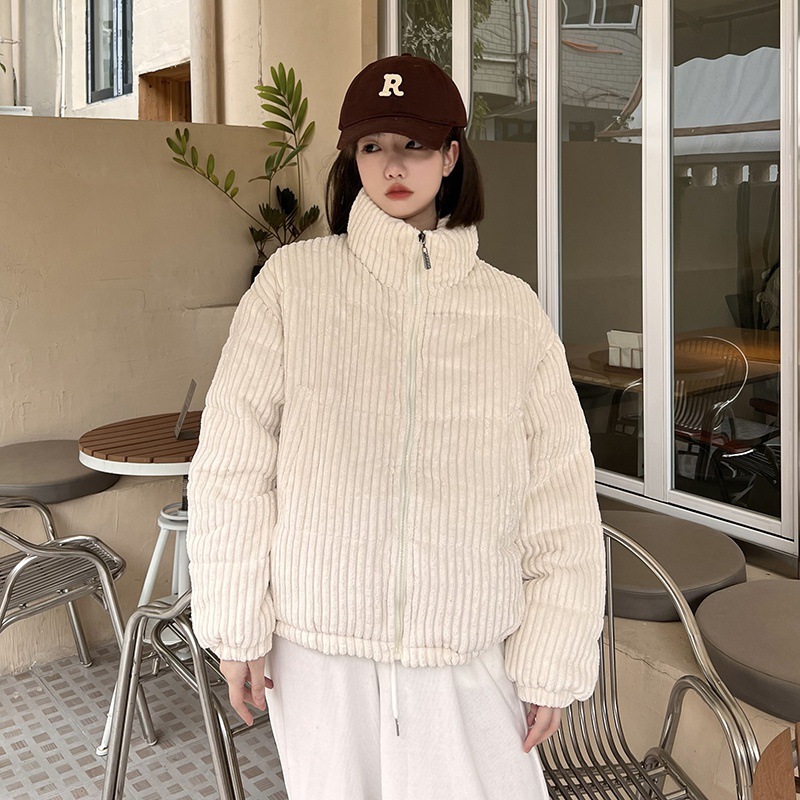 Short women's winter jacket made of corduroy with stand-up collar
