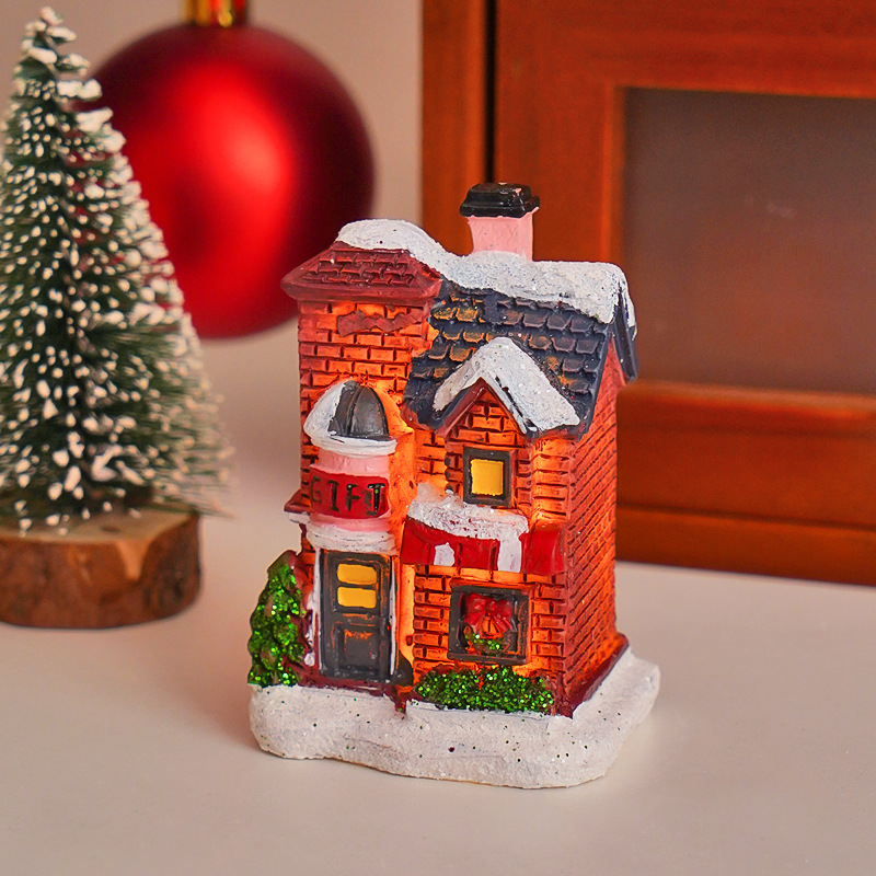 Illuminated Christmas Cottage made of resin