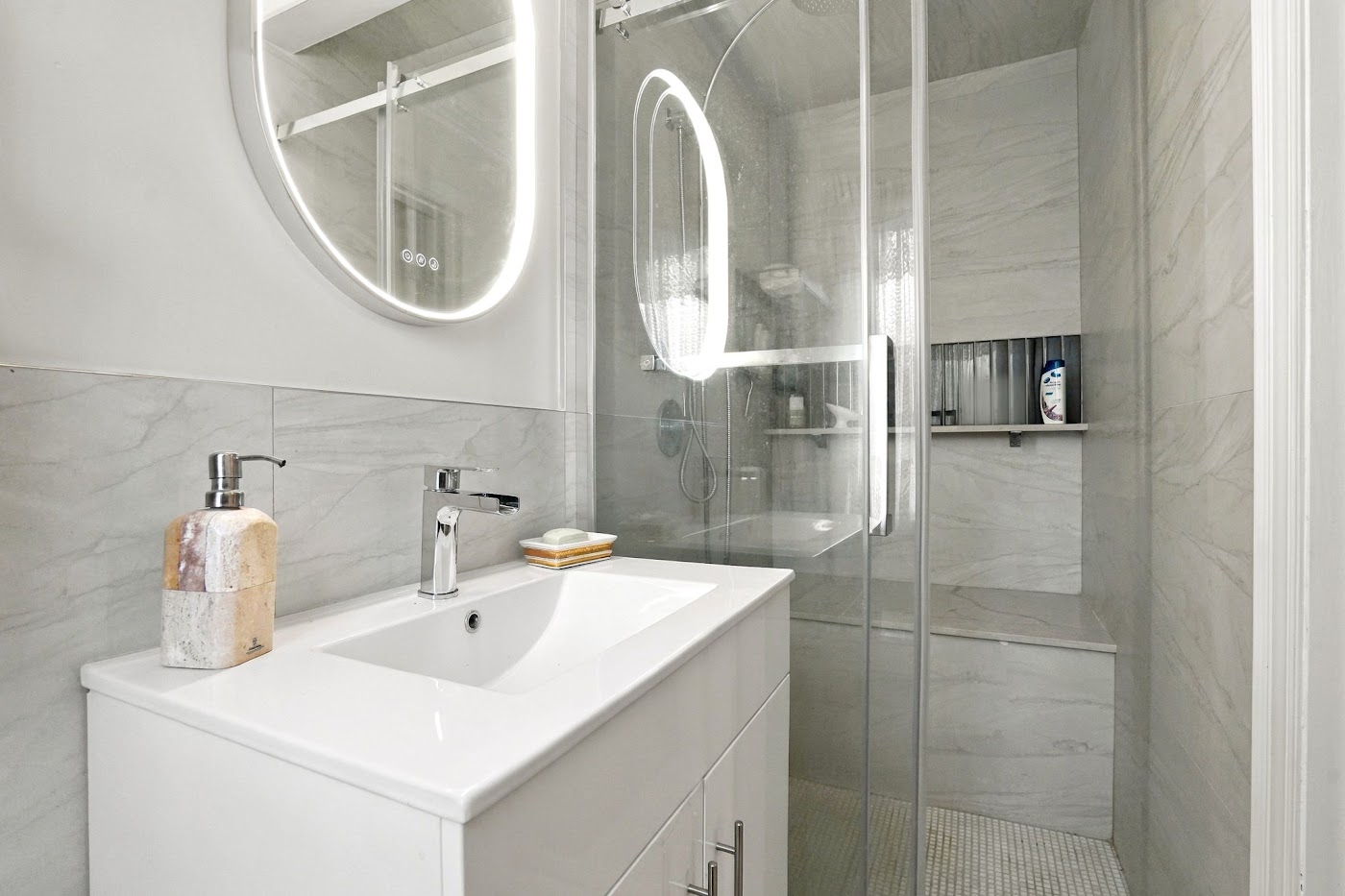 Renovated bathroom with a glass shower