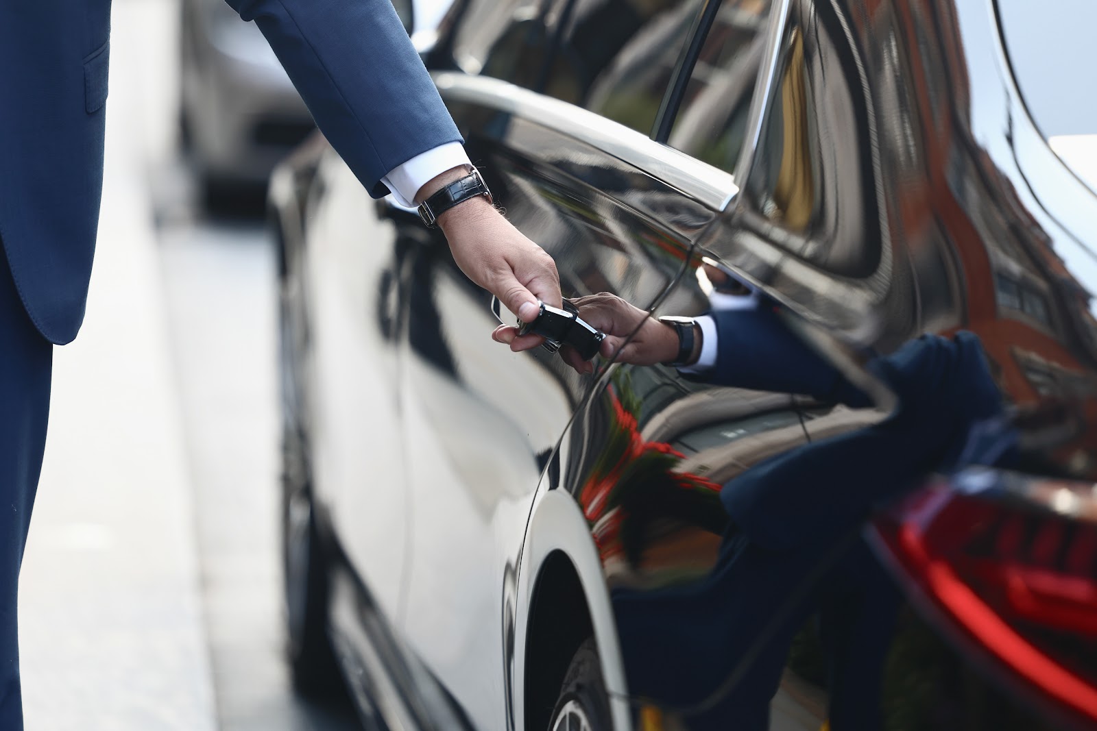 Chauffeur opening the door for a passenger