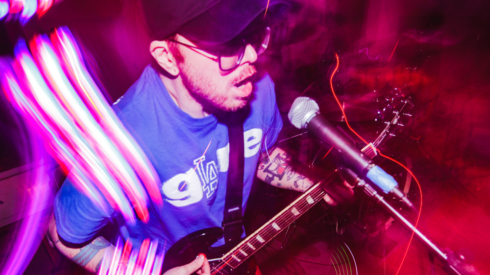 The members of Warm Veins playing on stage