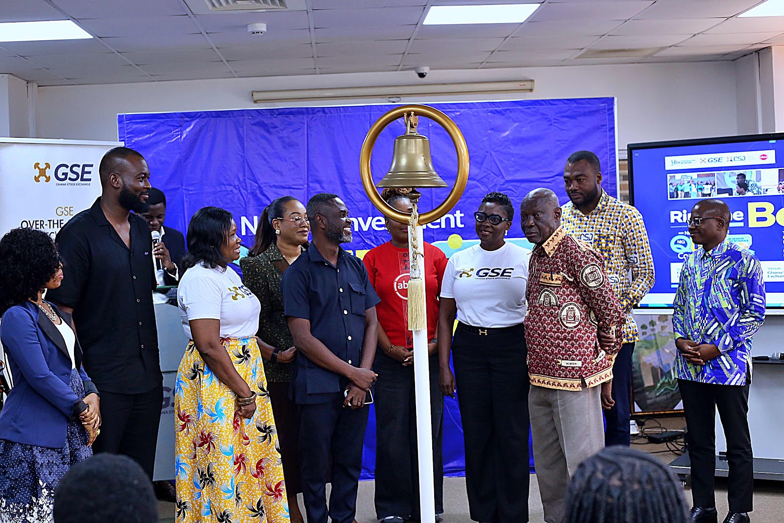Dignitaries gathered around the ceremonial bell at the Ghana Stock Exchange