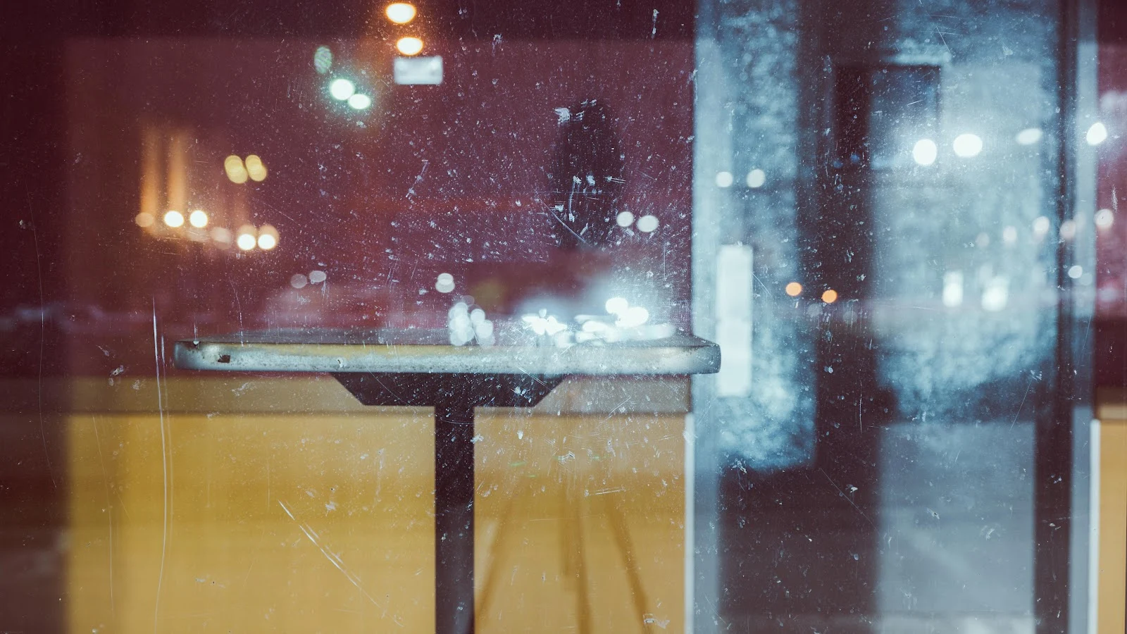 Reflective Cafe Window at Night - Cinematic Photography 5K Wallpaper (5922x3331)