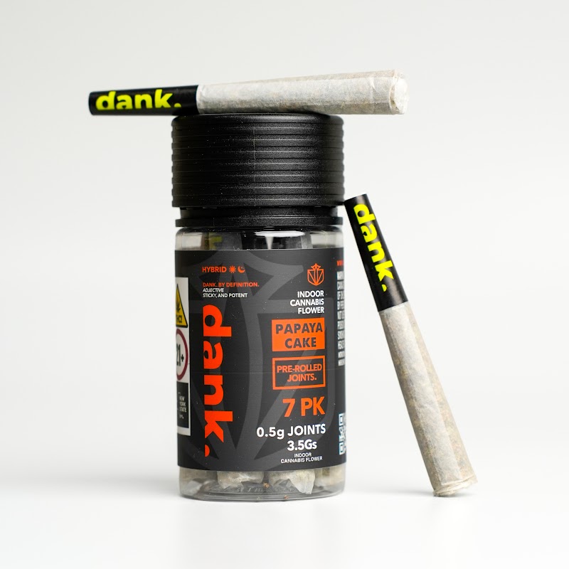 Pre-rolled joints jar with joint leaning — cannabis product photography