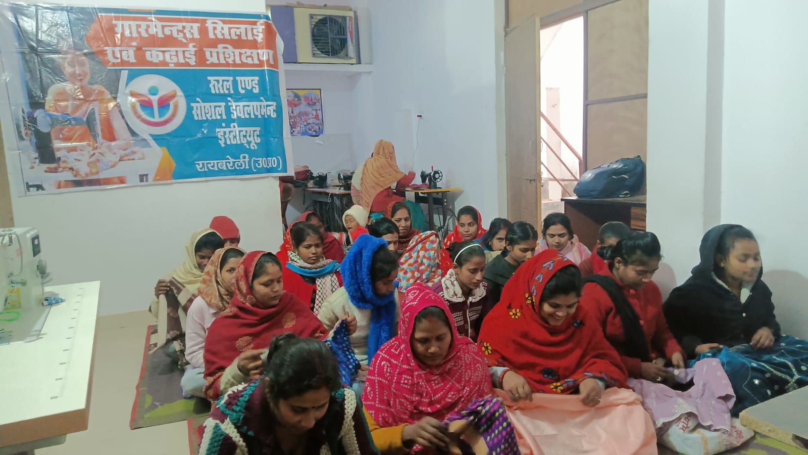 Women participating in garment sewing and embroidery training