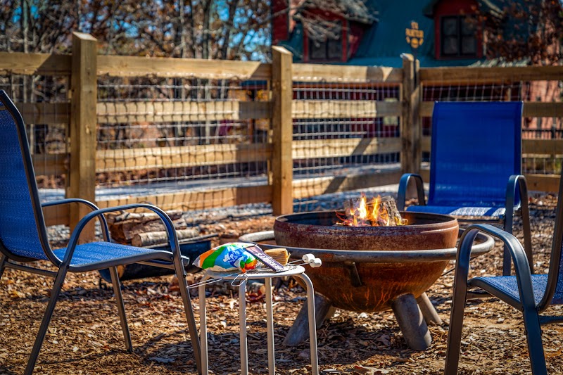 Fire pit in the fenced yard at Orchard & Vine Mountain Haus, Ellijay Georgia