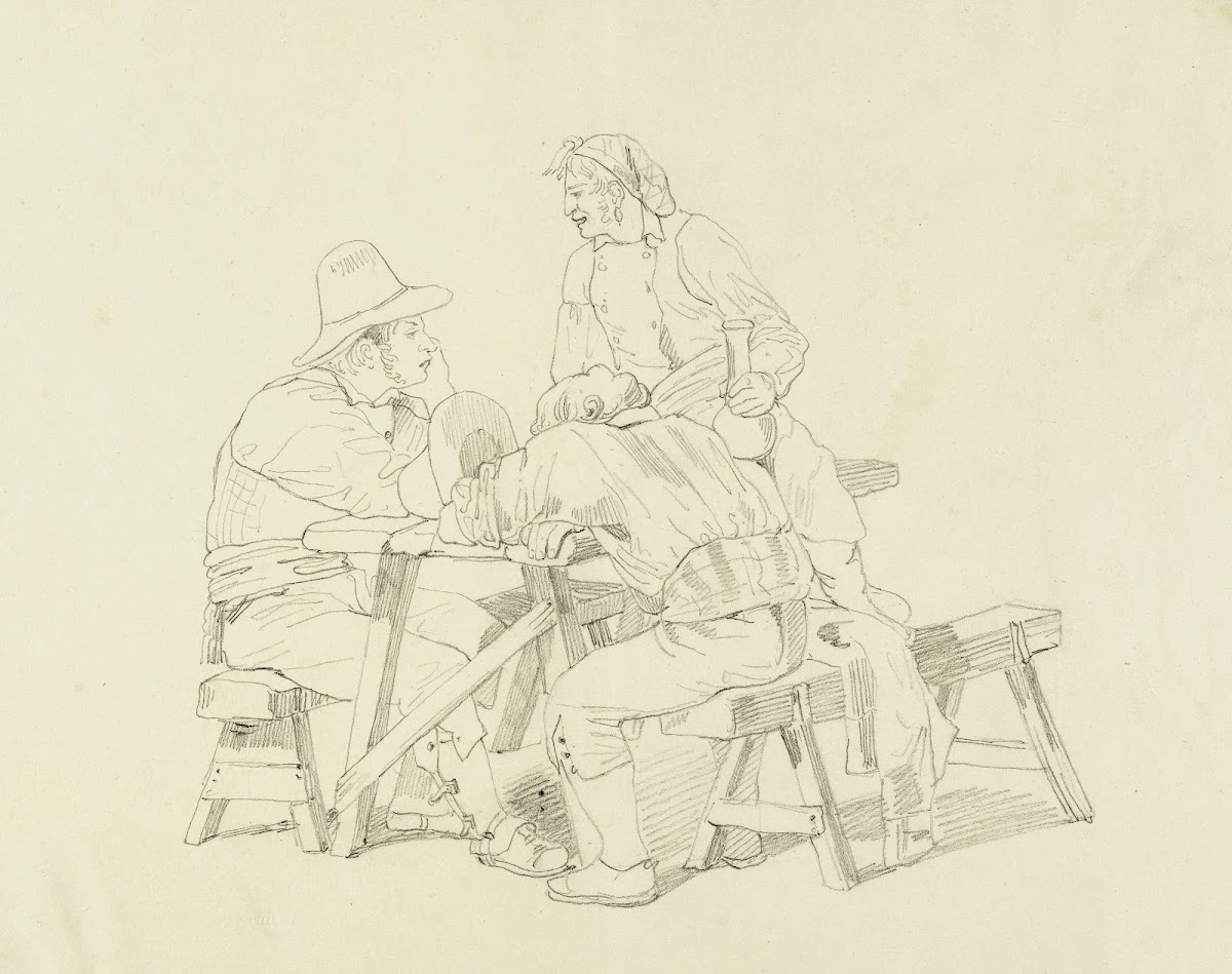 Trois hommes assis à une table