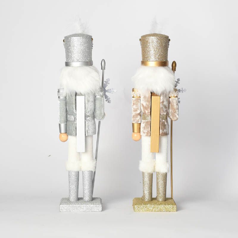 Decorative wooden nutcracker figure with snowflake design