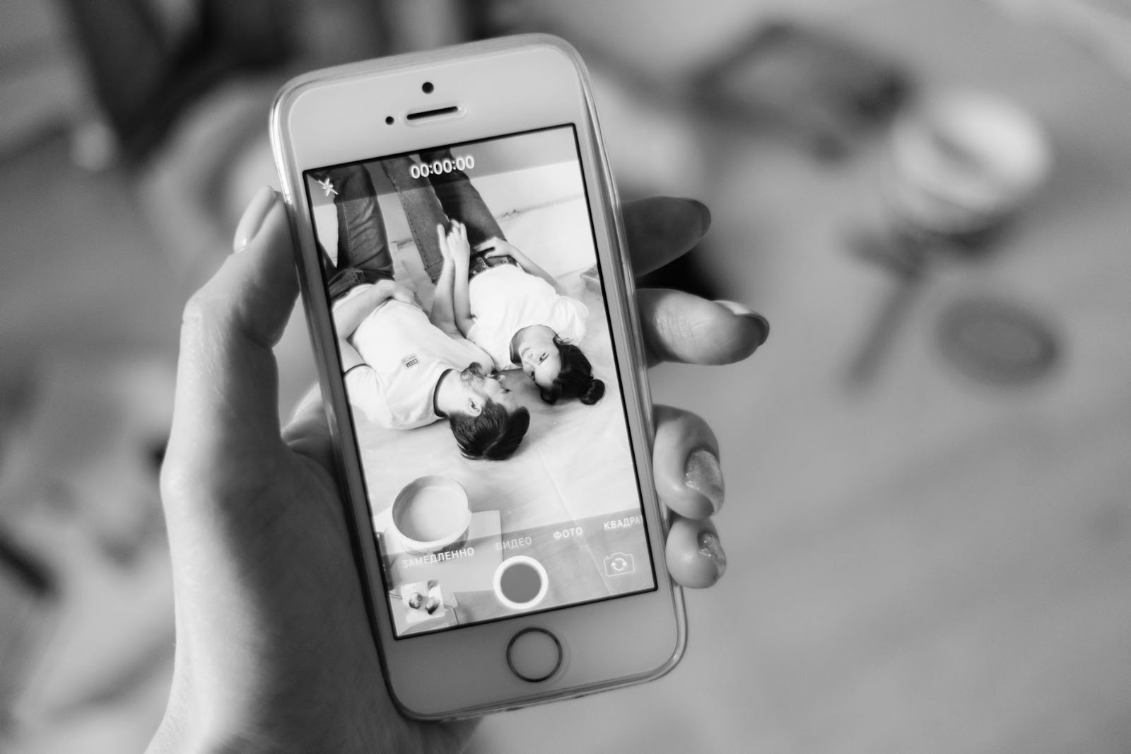A confused couple staring at a smartphone screen, symbolizing the complexities and potential miscommunications in AI dating apps and digital romance.