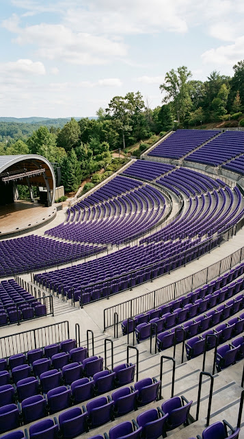 Modern Outdoor Amphitheater with Rows of Deep Purple Seating - Free mobile Wallpaper