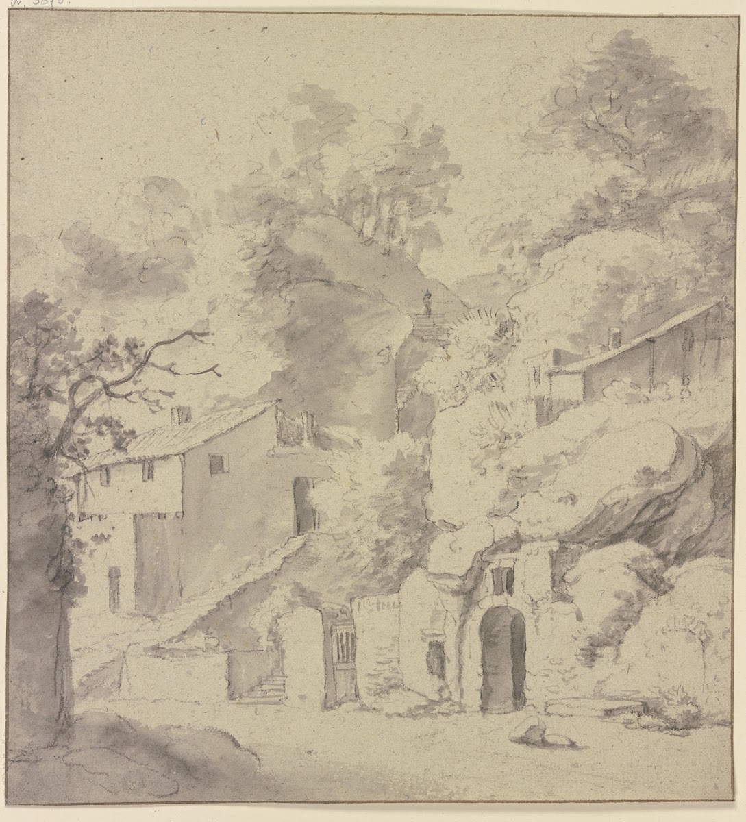 Houses in front of a cliff