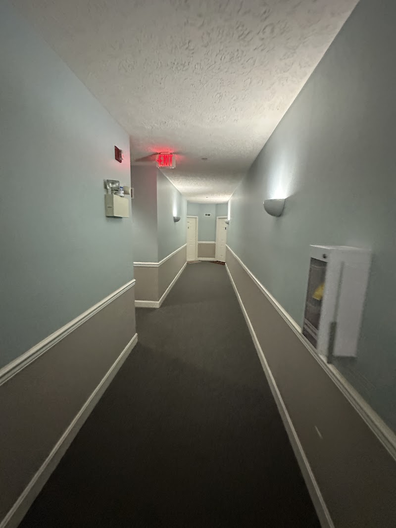 Yardley Court hallway before repaint, worn walls and dated color