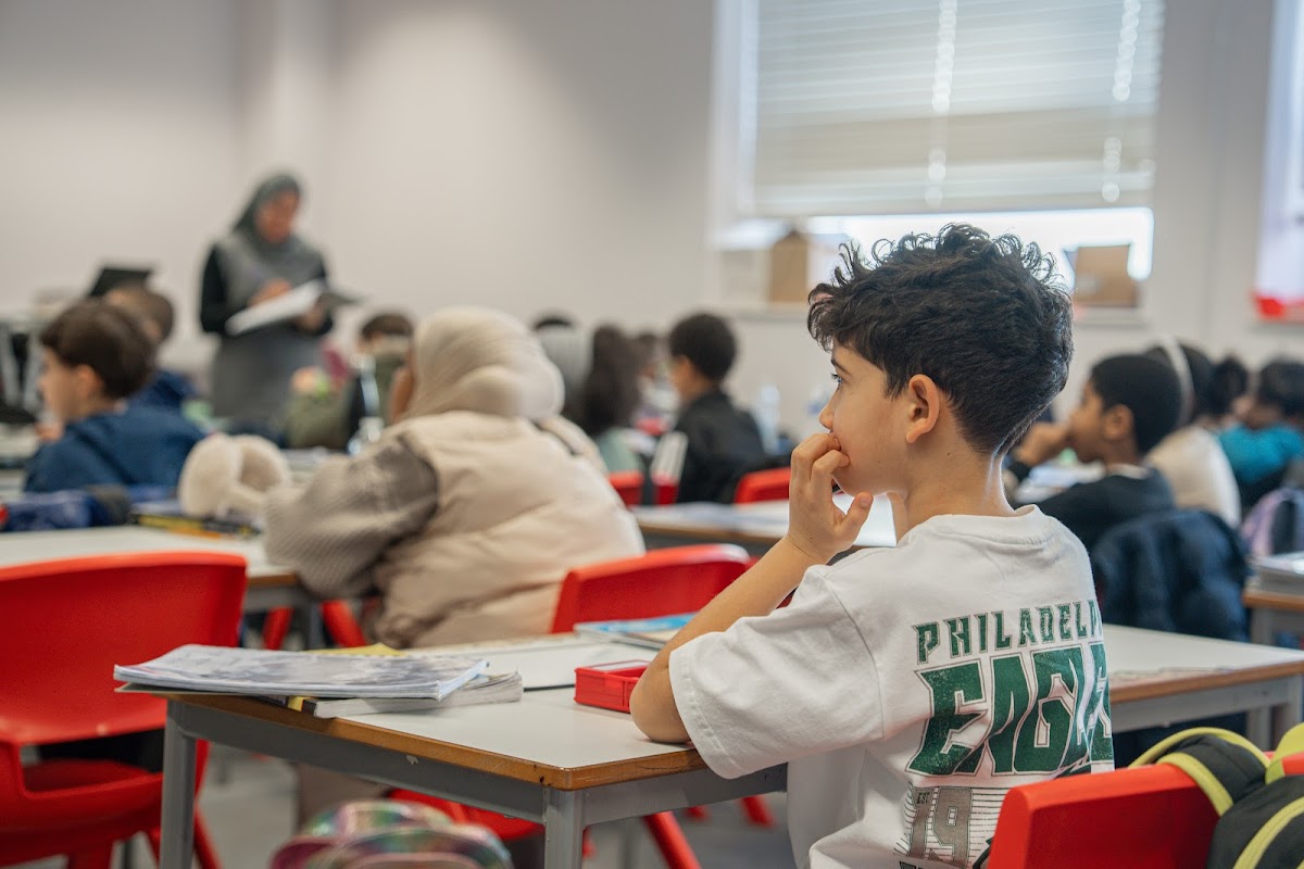 Student listening to the teacher during class