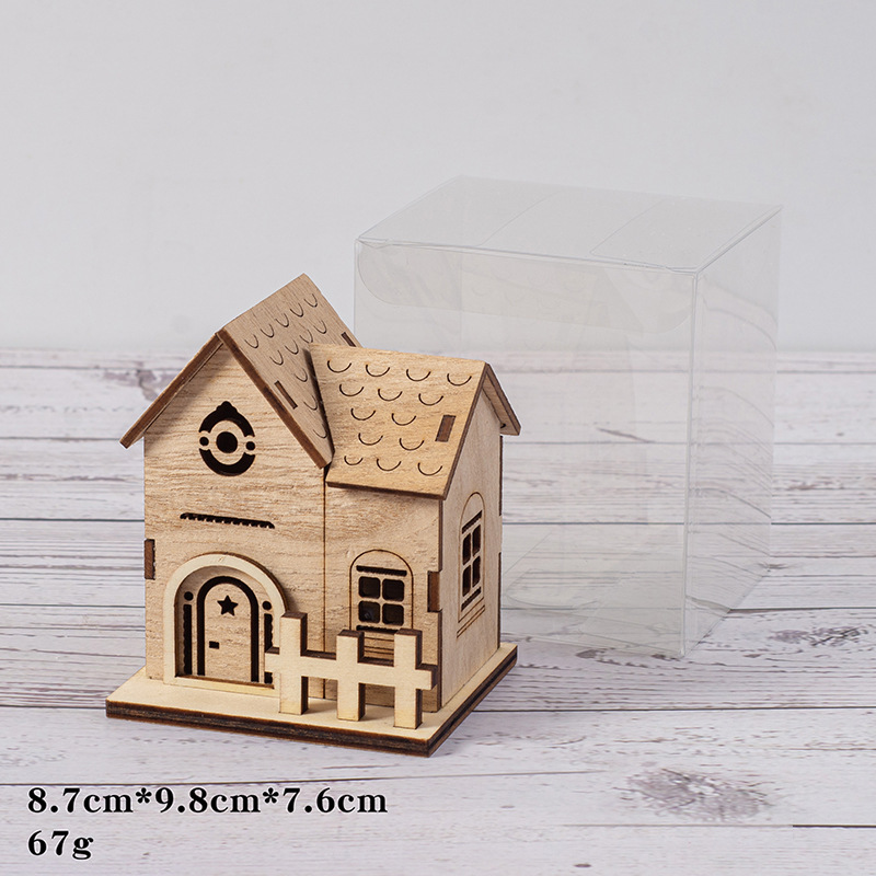 Illuminated wooden house for Christmas decoration