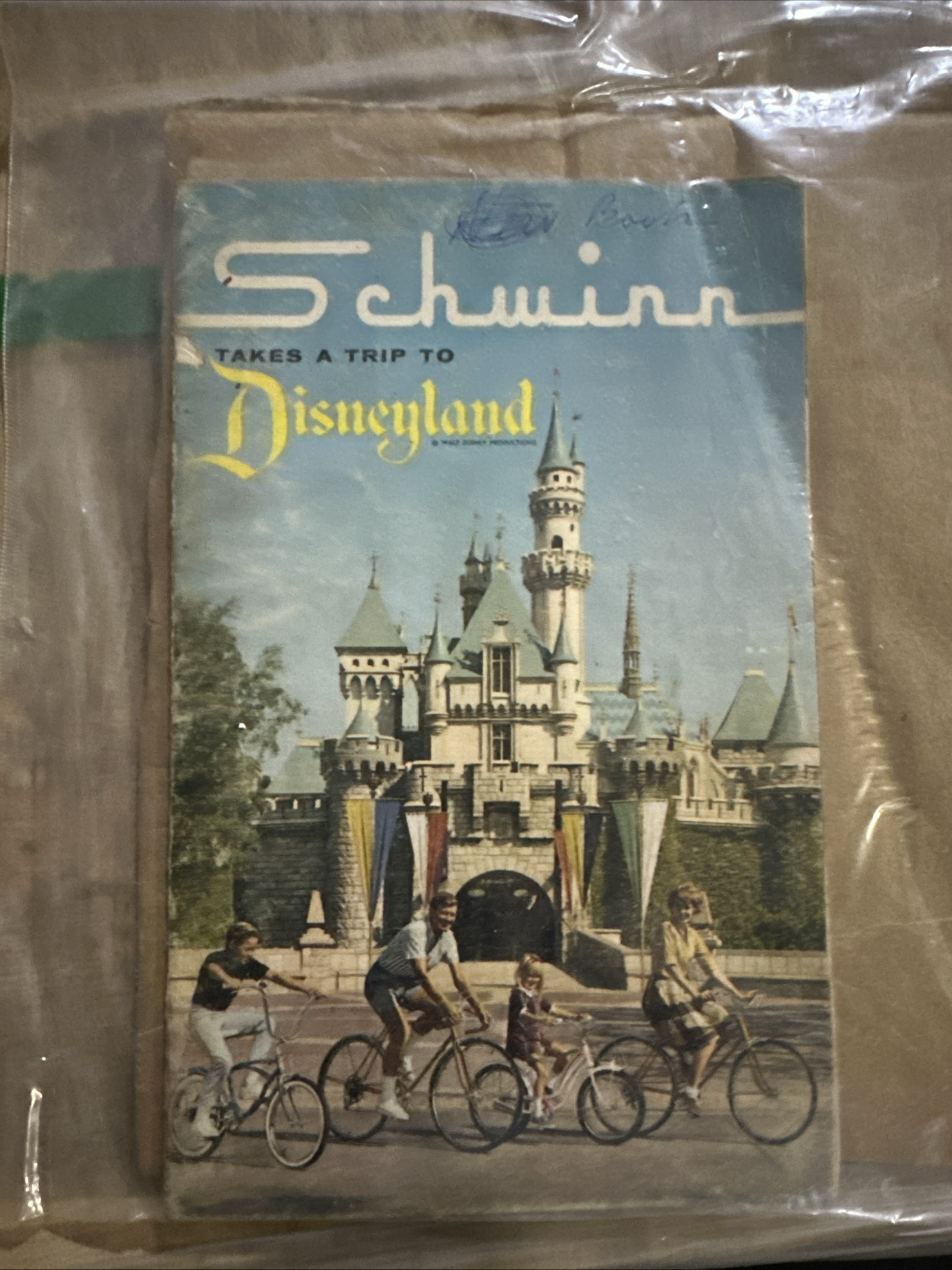 1965 Schwinn Takes a Trip to Disneyland promotional booklet with Disneyland park imagery and vintage Schwinn bicycle branding, showing minor edge wear consistent with age