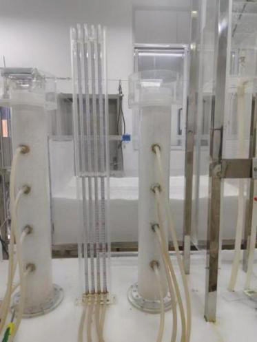 Mechanistic Study on Deposition Characteristics of Microorganisms in Layered Sandy Soil During Water-Source Heat Pump Reinjection