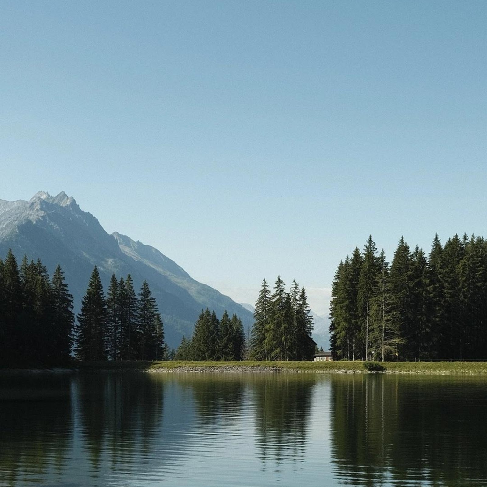 Download Rowboat On Calm Alpine Lake Full HD iPhone