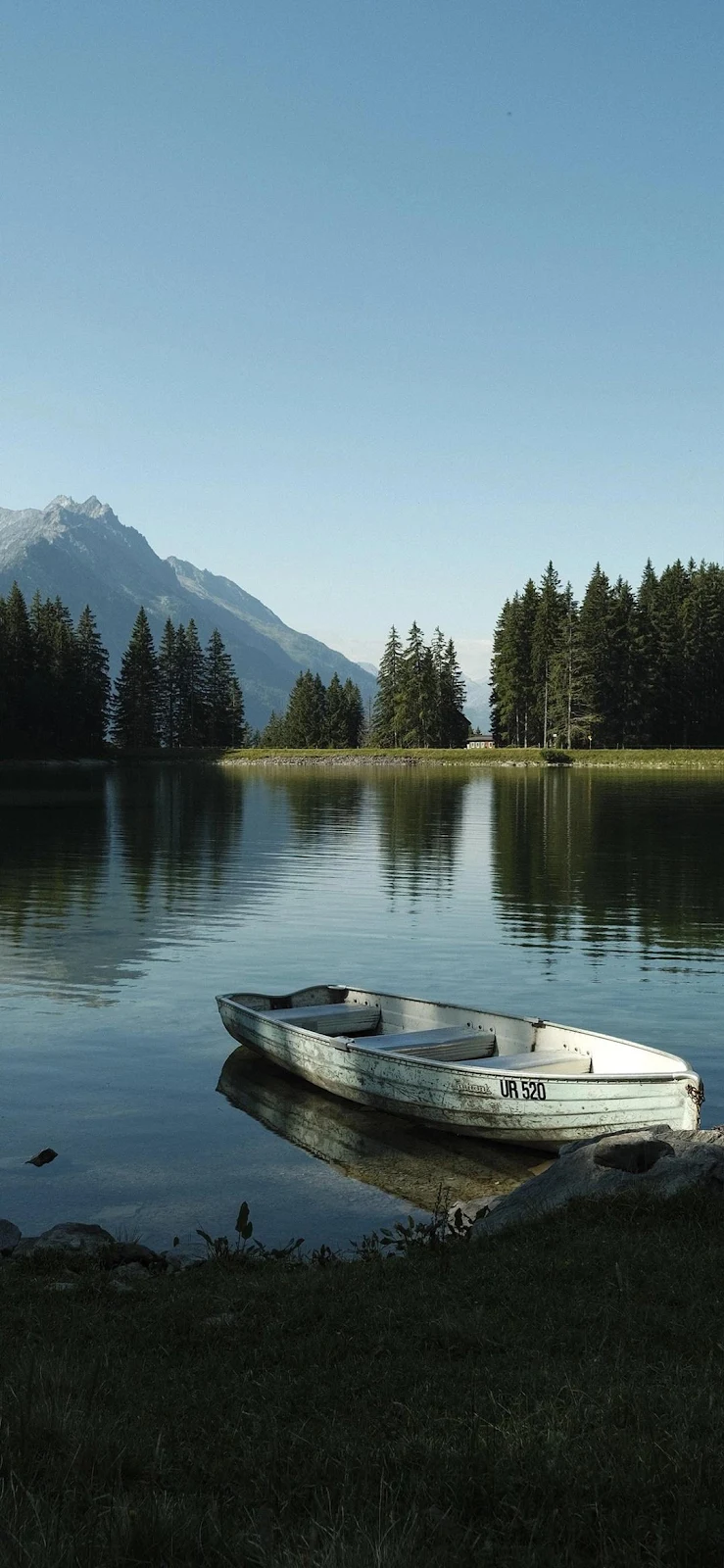 Rowboat On Calm Alpine Lake - Landscape Photography Full HD iPhone Wallpaper (1080x2337)