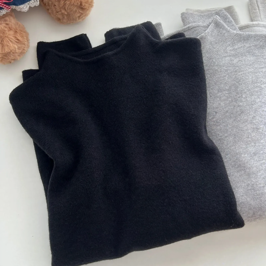 Women's knit pullover with stand-up collar, solid color