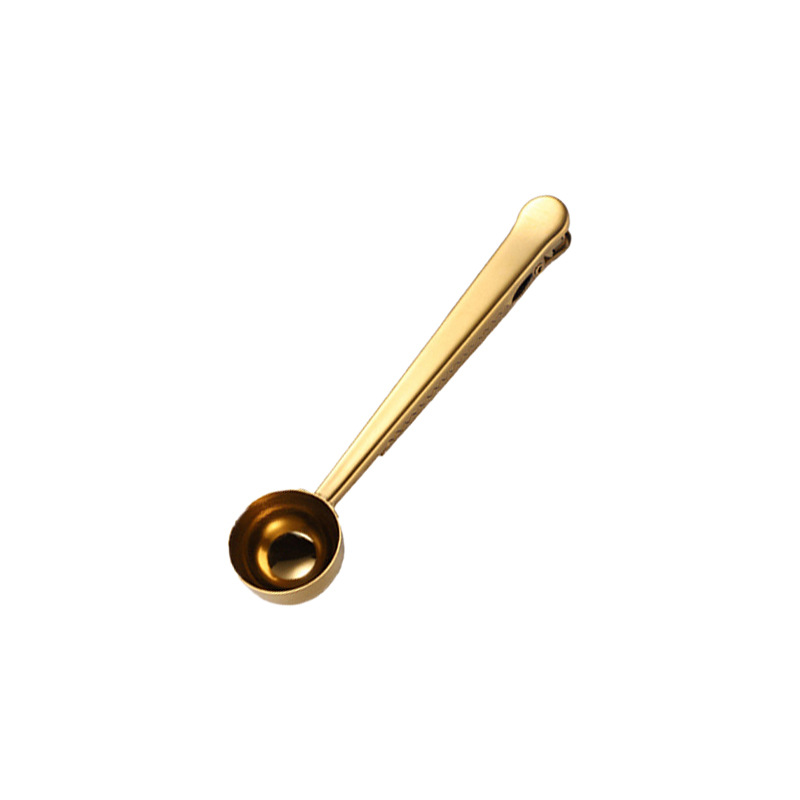 Stainless steel measuring spoon with closure clip