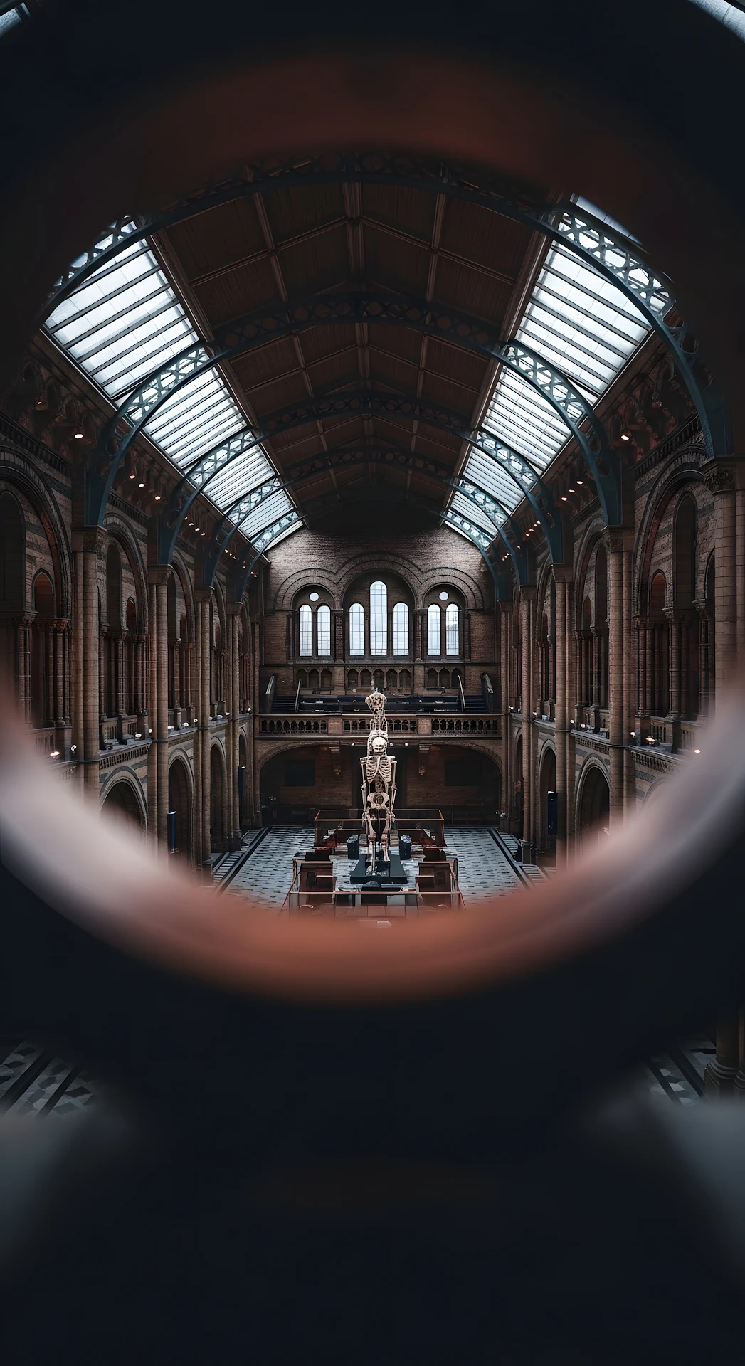 Dramatic View of Grand Victorian Museum Hall Through Blurred Copper Railing - Free 4K mobile Wallpaper