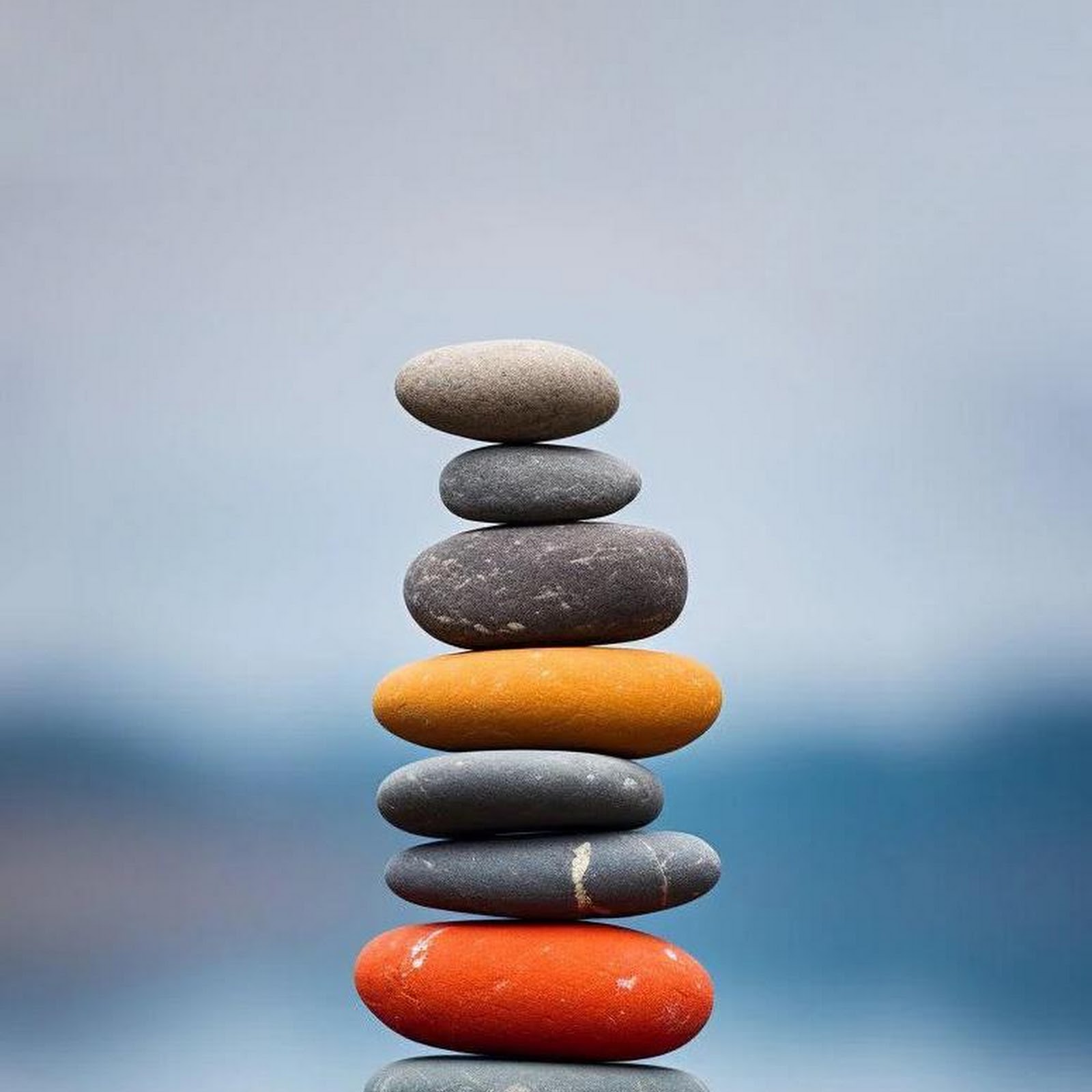 Download Stacked Zen Stones Over Water iPhone