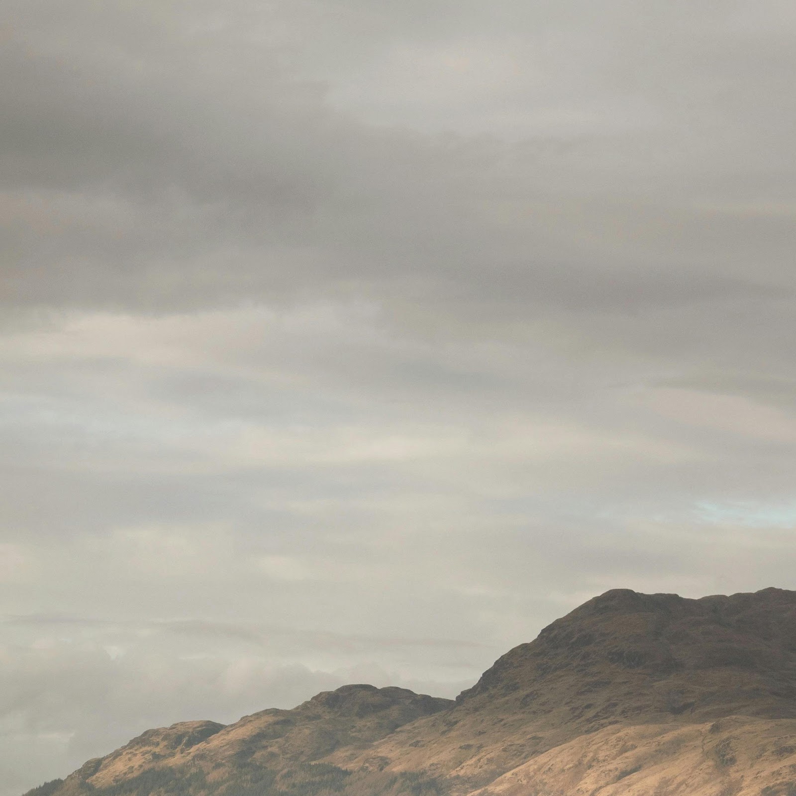 Download Calm Loch Under Muted Skies 4K iPhone