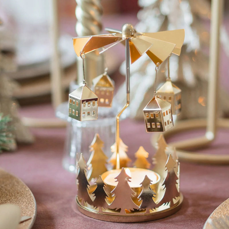 Rotating brass tealight holder with star motif