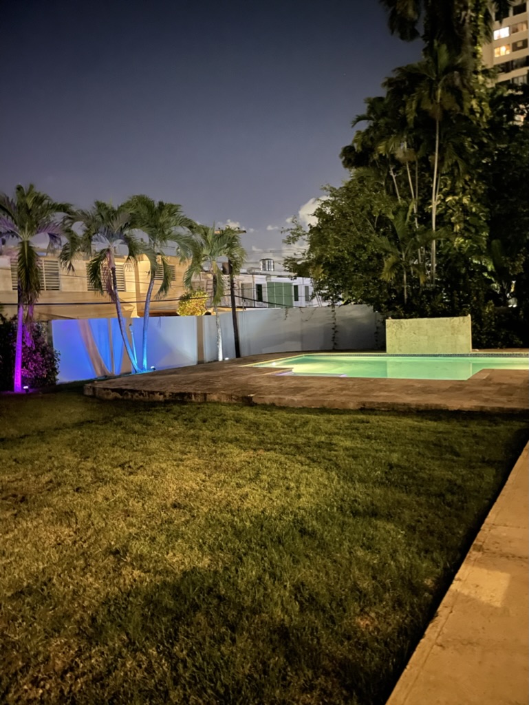 The pool at The Palatial Retreat lit up at night
