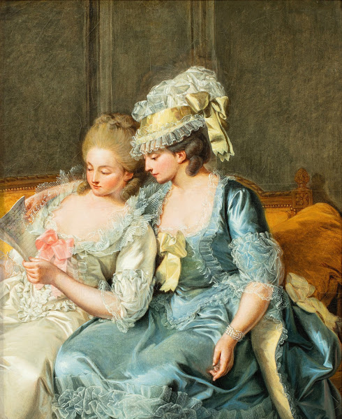Two young women reading a Letter
