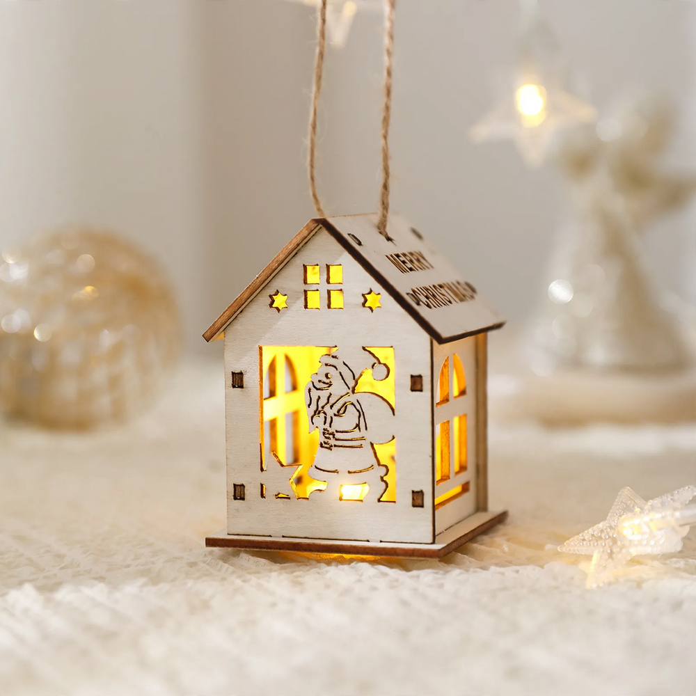 Illuminated wooden house as Christmas decoration