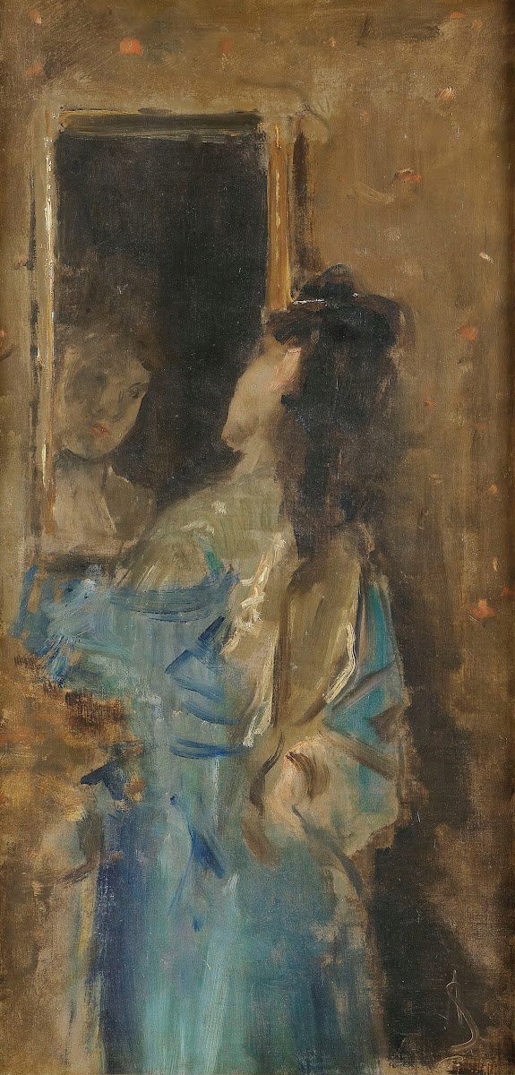 Girl in blue looking in a mirror