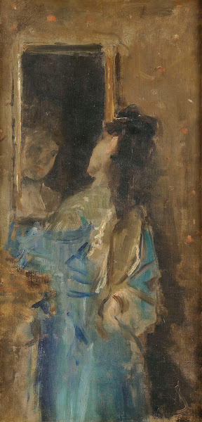 Girl in blue looking in a mirror