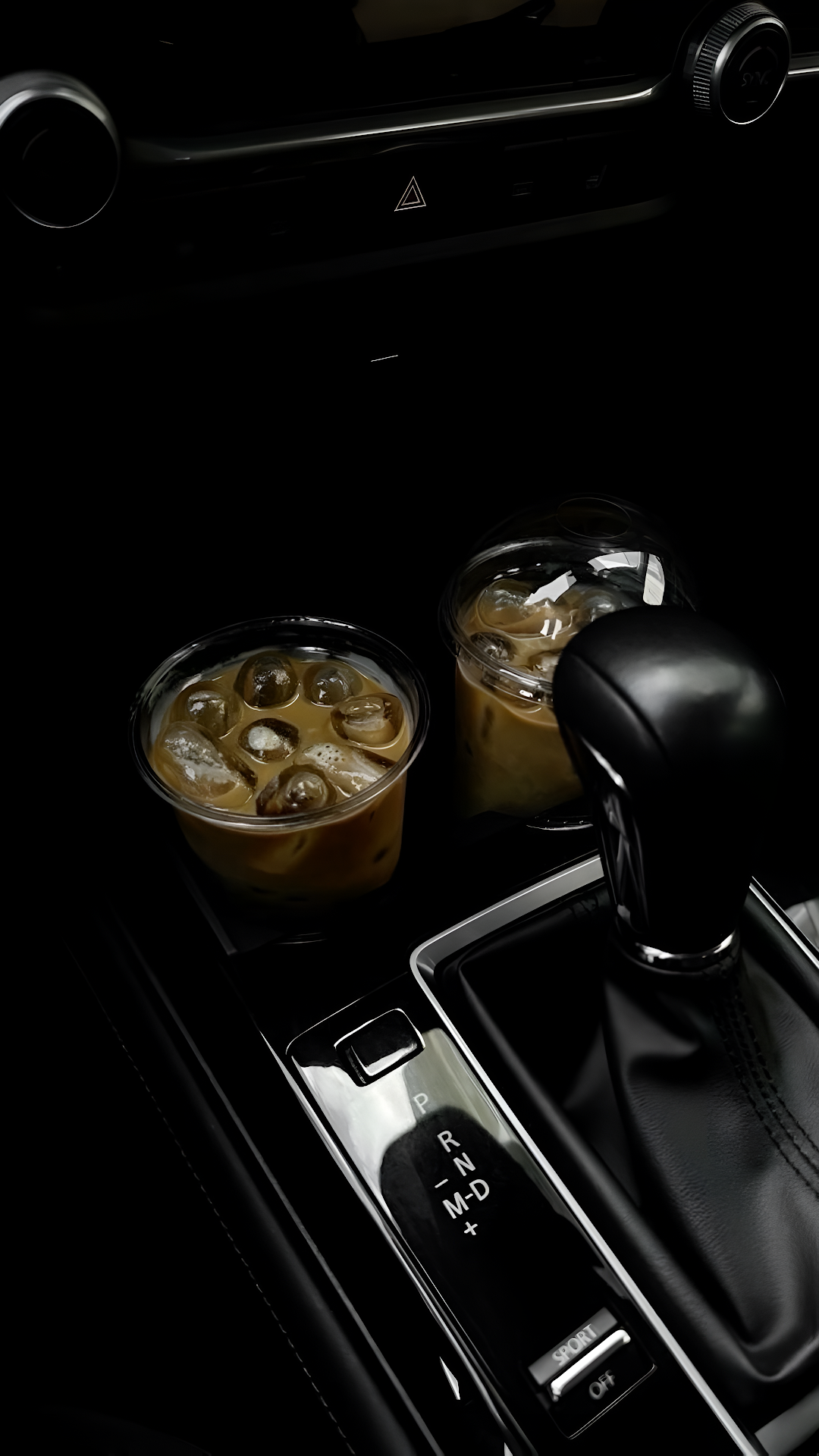 Iced Coffee Cups in Car Center Console at Night - Free 4K mobile Wallpaper