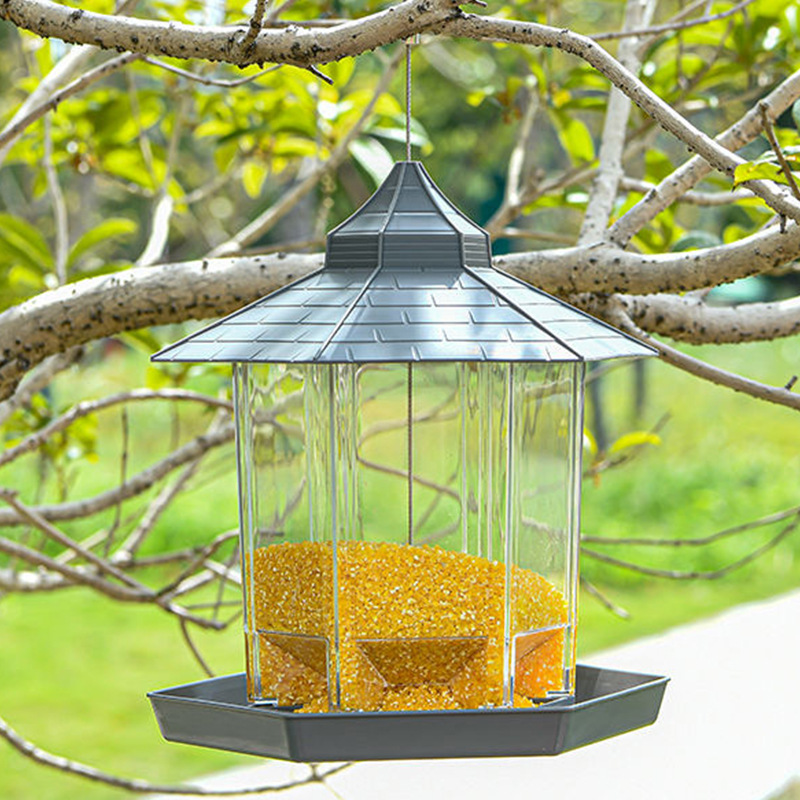 Transparent, weatherproof hanging bird feeder