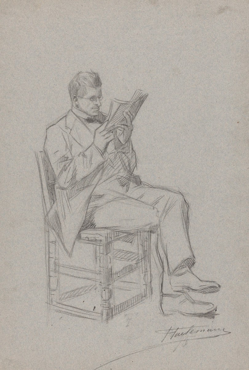 Homme lisant assis sur une chaise