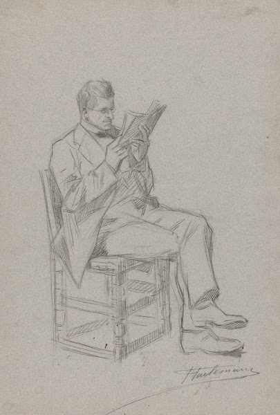 Homme lisant assis sur une chaise