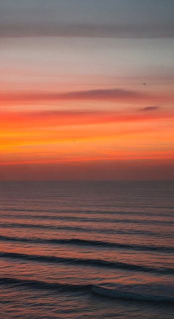 Minimalist High-Angle Photo of Dramatic Orange Sunset Gradient Over the Ocean - Free mobile Wallpaper