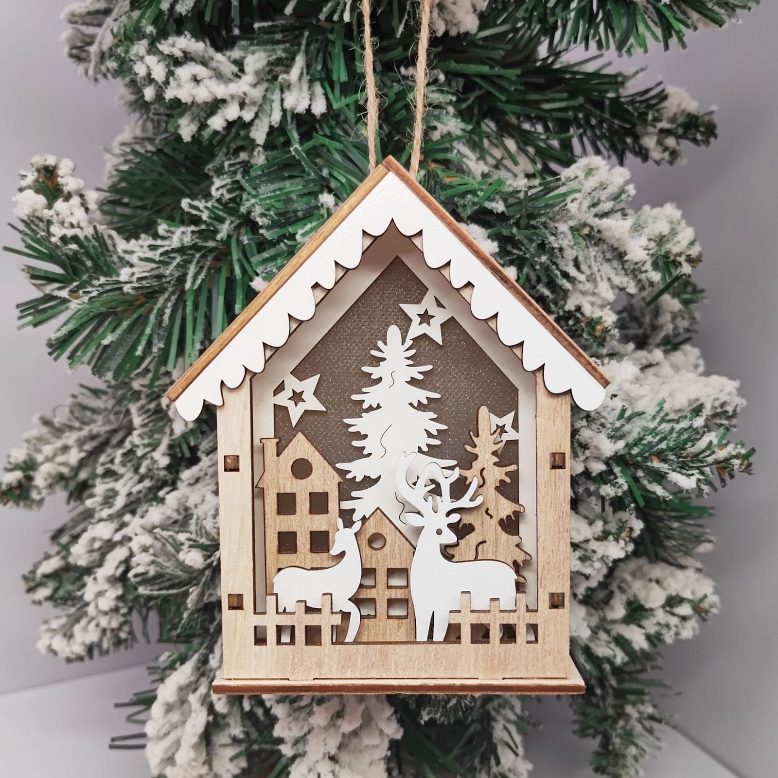 Lit Wooden Christmas House as Tree Decoration