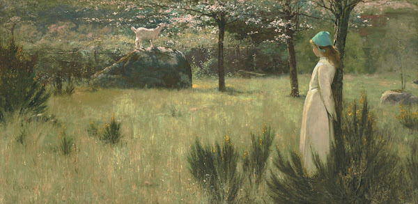 The young shepherdess and her goat in a springtime pasture