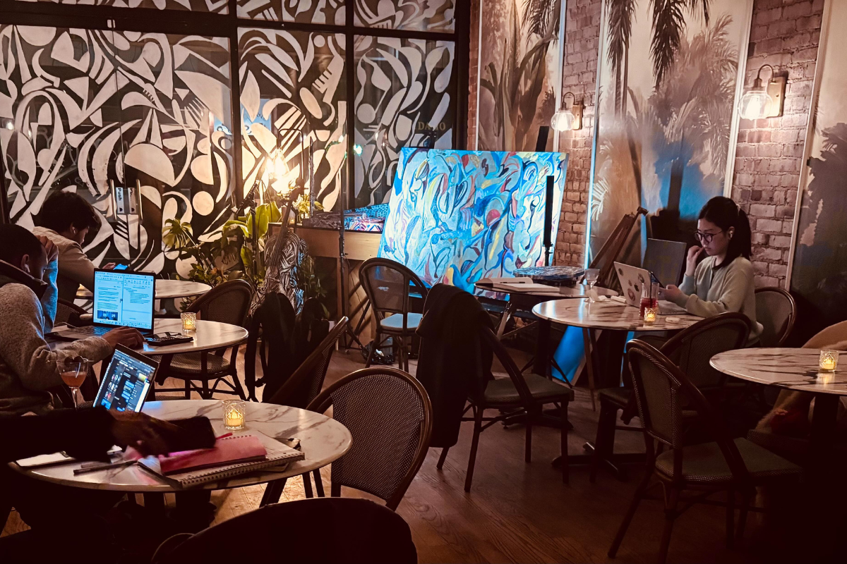 The interior of No More Cafe filled with guests