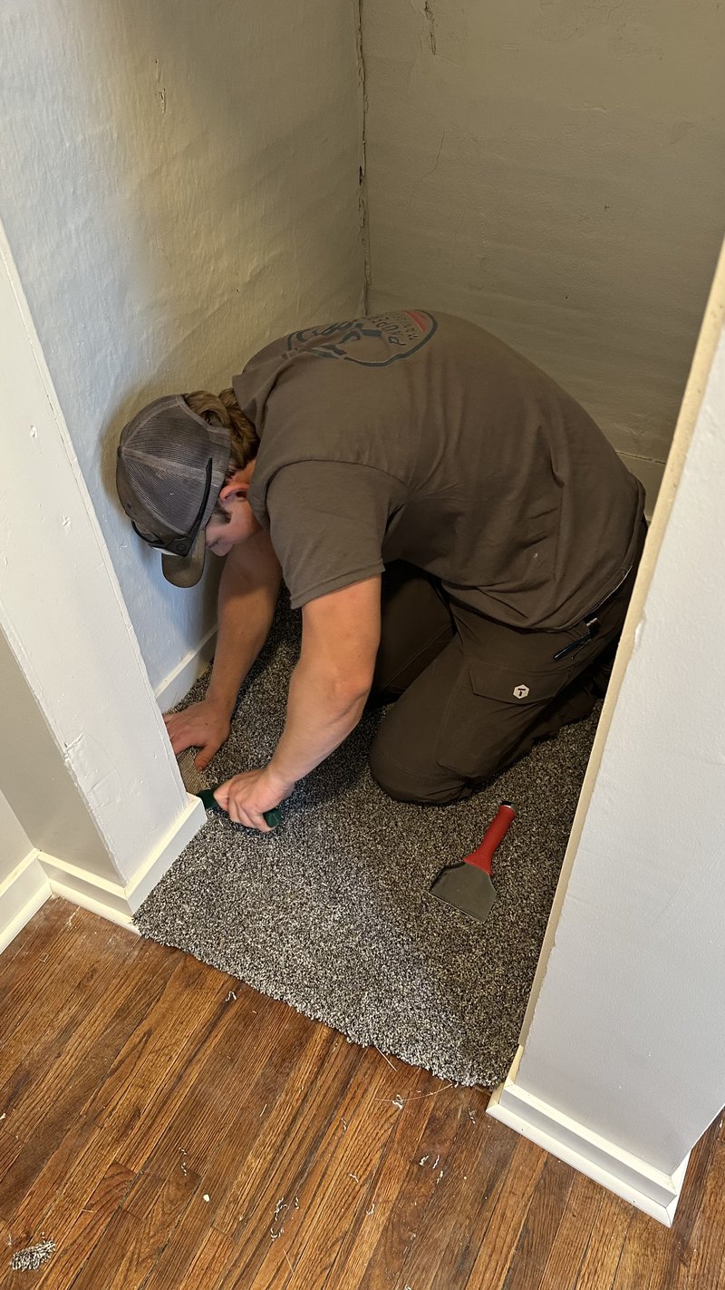 Gavin installing carpet in a Woodford County IL home