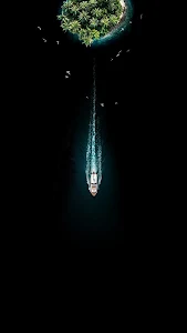 Minimalist Boat Leaving Tropical Island Aerial View