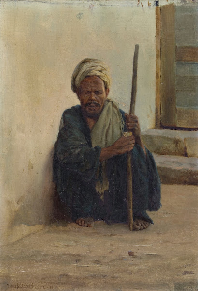 Louxor arabe tenant un bâton assis dans une rue ca 1892