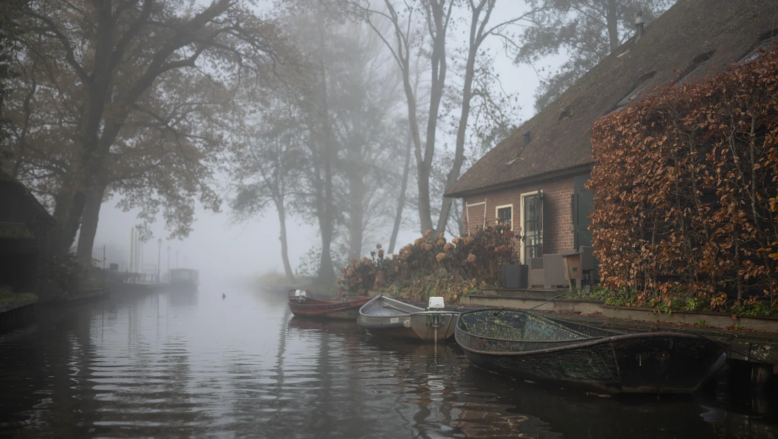 Foggy Canal Beside Brick Cottage - Atmospheric Photography 4K Wallpaper (4898x2768)