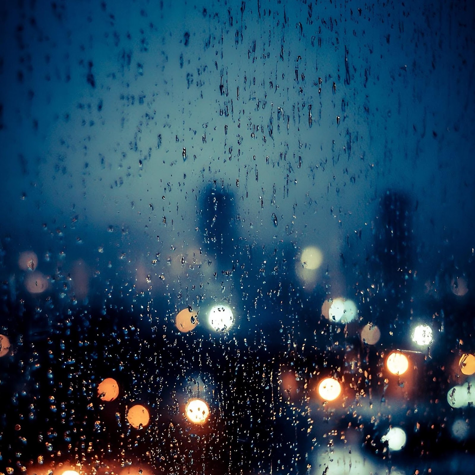 Download Rain On City Window At Night 2K iPhone