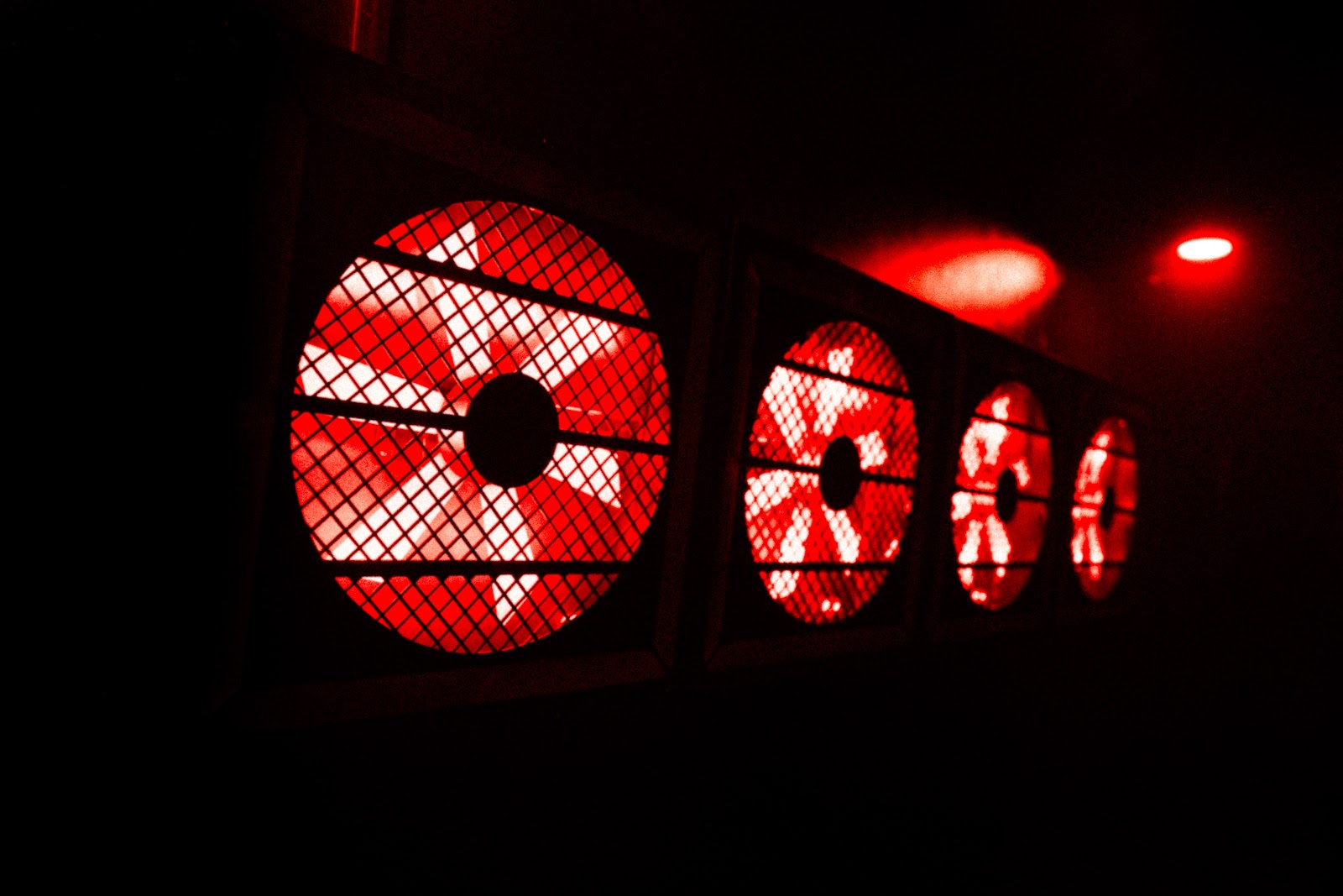 VENT nightclub signature industrial vent fans lit up in red