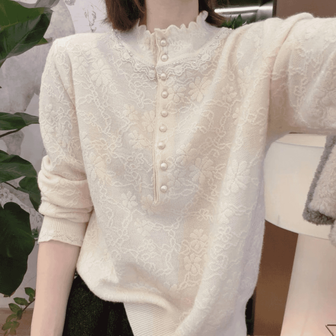 Women's knitted sweater with lace trim and pearls