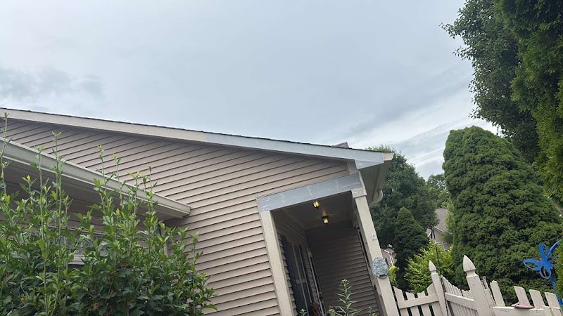 Fascia and soffit line on a Seneca Pointe building during exterior wood repair and painting work