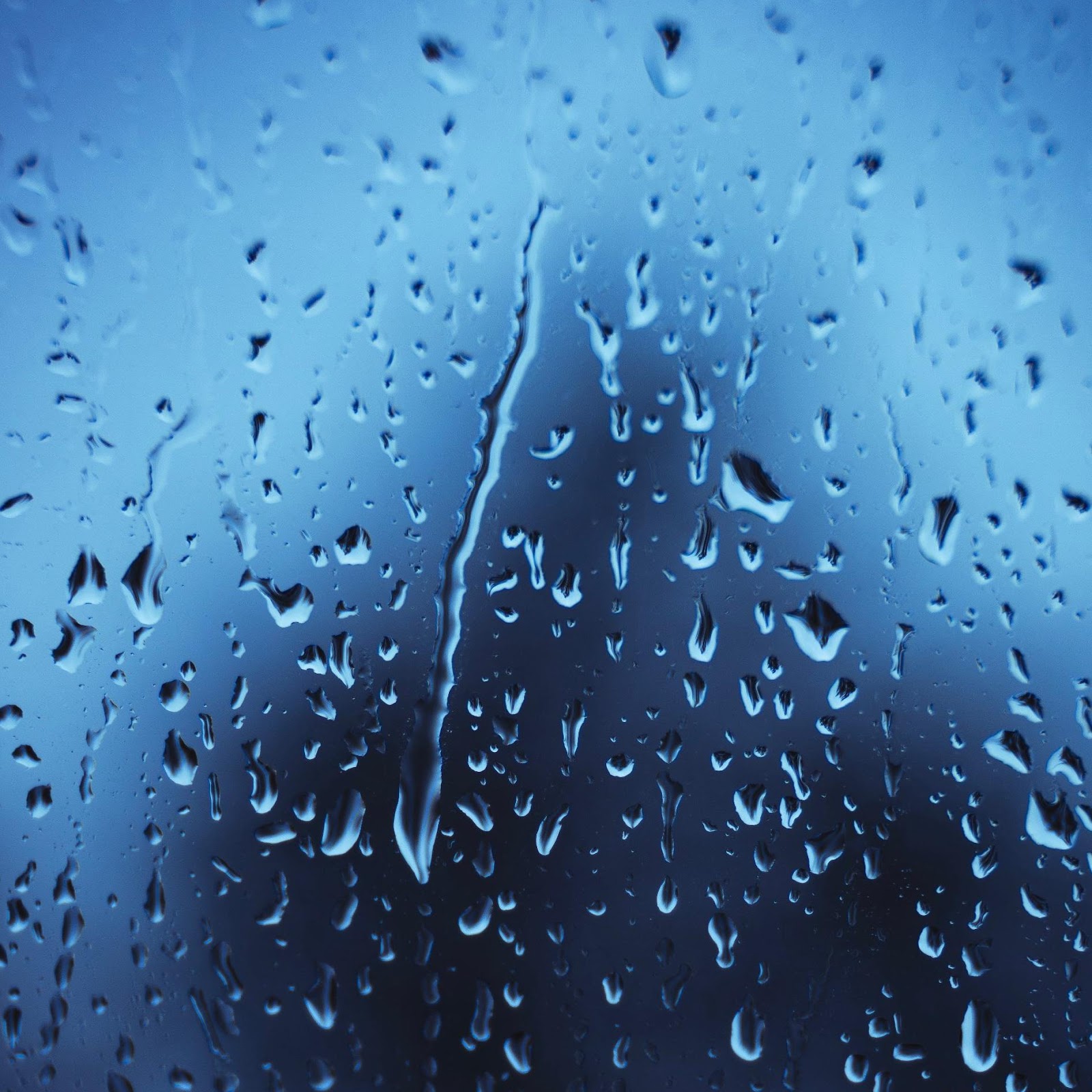 Download Raindrops On Blue Glass Surface 2K iPhone